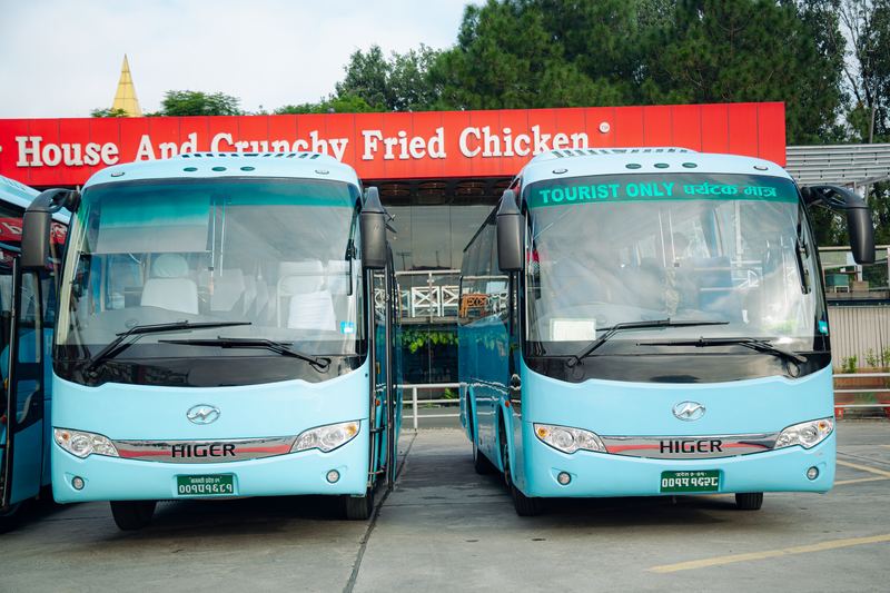Two sky-blue Higer coaches, tourist-licensed and ready
